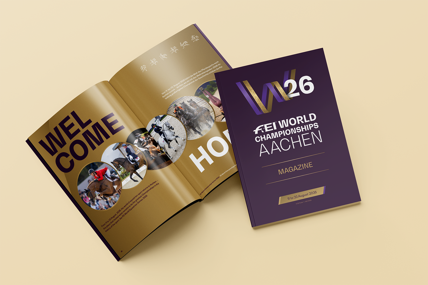 Grafik eines Magazins zur FEI World Championships Aachen 2026: Links ist ein aufgeschlagenes Heft mit der Überschrift „WELCOME HOME“ und Reitsportfotos zu sehen, rechts liegt das Cover mit dem Logo „W26“ und dem Titel „FEI World Championships Aachen – Magazine“ sowie dem Datum „11 to 23 August 2026“.